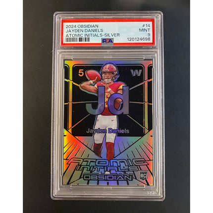 Jayden Daniels 2024 Obsidian 14 Commanders Atomic Initials Silver 67/99 PSA 9